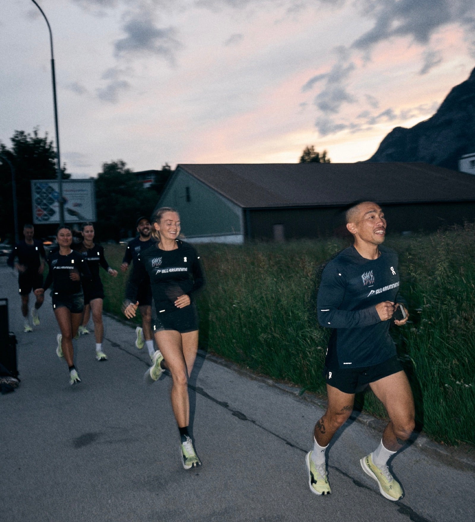 Group of runners at dusk on a long endurance effort
