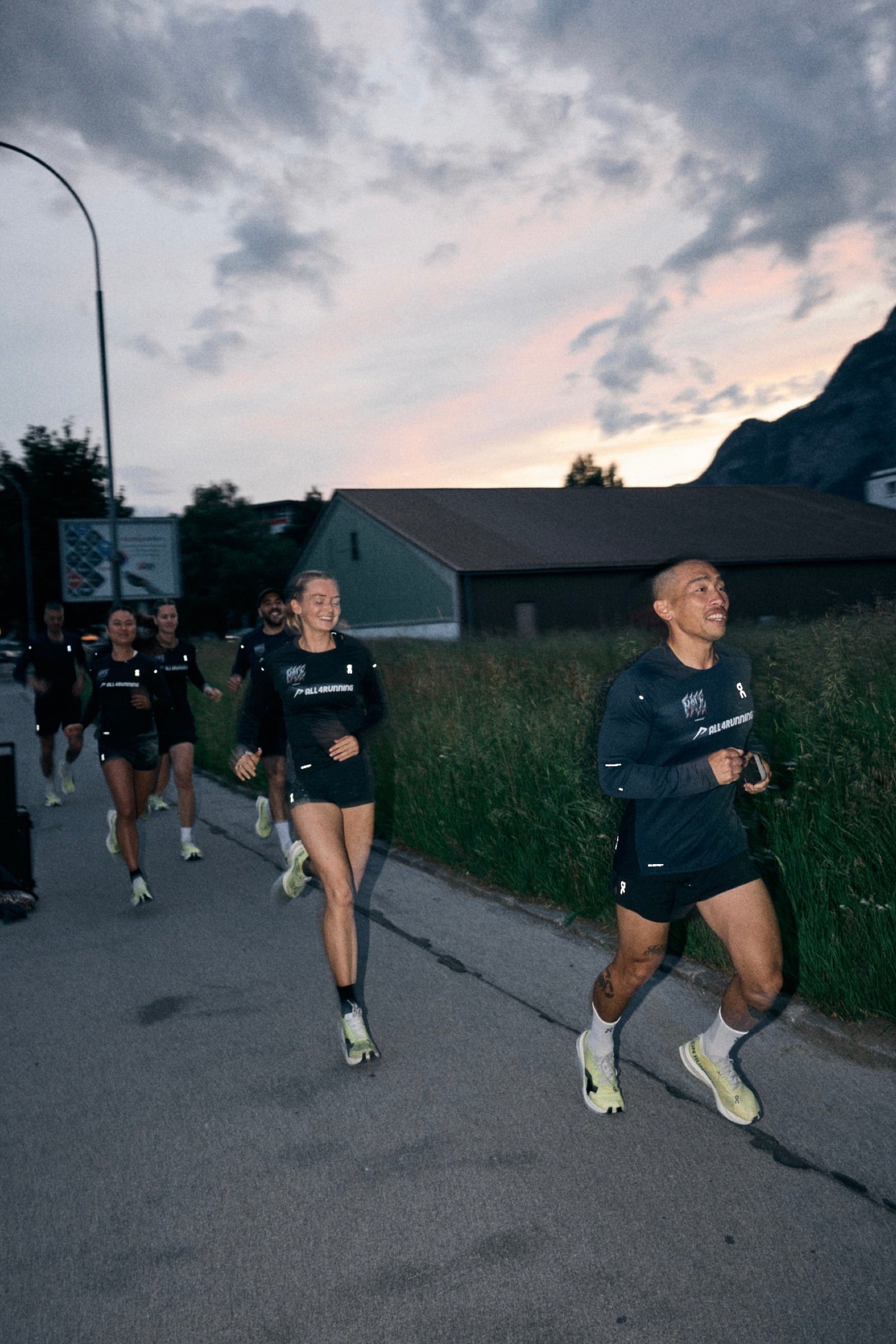 Group of runners at dusk on a long endurance effort